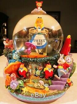 Alice In Wonderland Drink Me Snow Globe, plays All in the Golden Afternoon