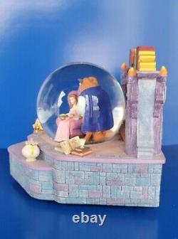 Beauty and the Beast Library Disney Store Snowglobe. Belle reads as old as time