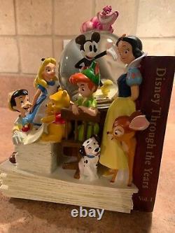 DISNEY Through the Years Volume 1 & 2 Snowglobes Bookends Music Box