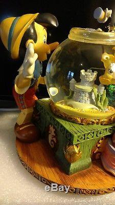 Disney Pinocchio Snow Globe RARE Toyland Musical/Animated