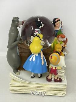 Disney Store Through The Years Vol. 1 Musical Snow Globe and Bookend
