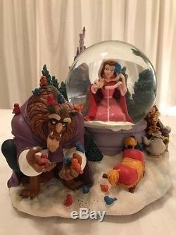 Disney's Beauty and the Beast Snowglobe Winter scene Belle in pink dress
