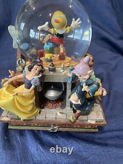 Disneys Pinocchio & Snow White Share a Dream Come True Musical big snow globe