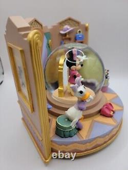 Minnie's boutique with Minnie, Daisy & Amp Disney snow globe